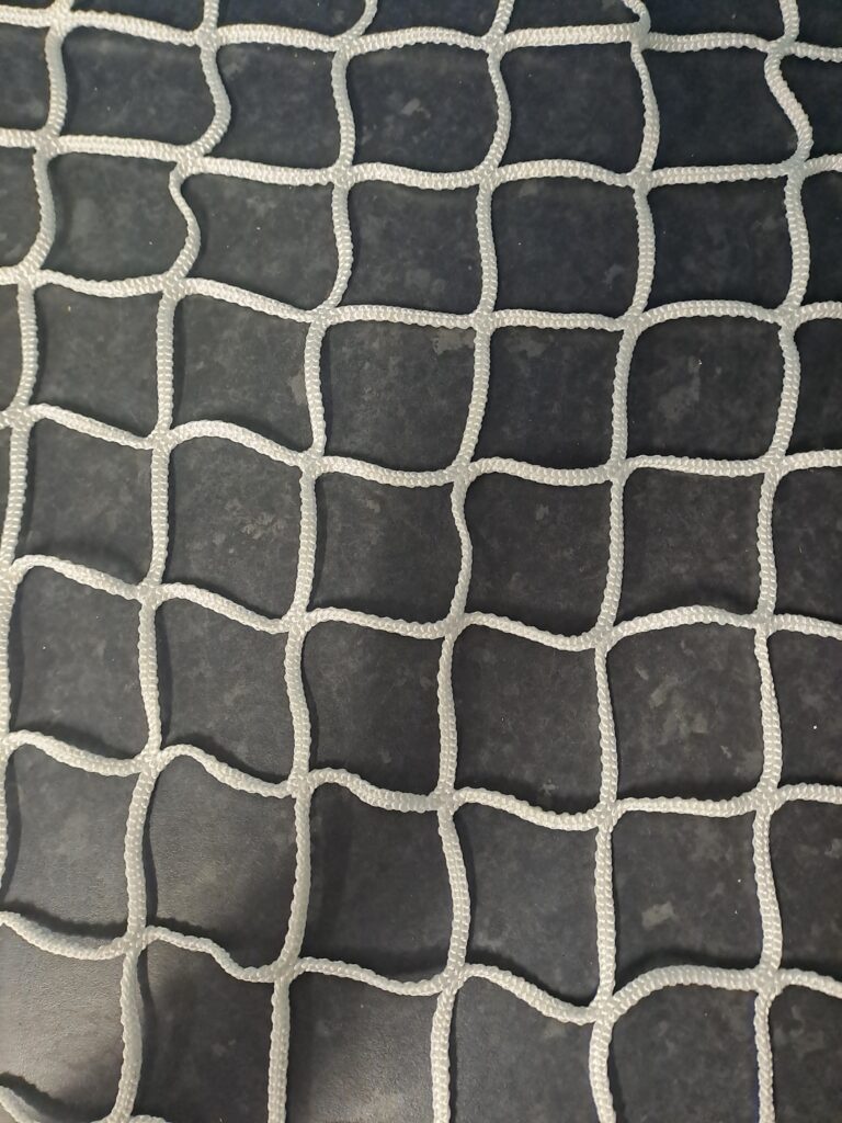 White-knotless net for hire from Allied Perimeter Safety Netting on floor of premises